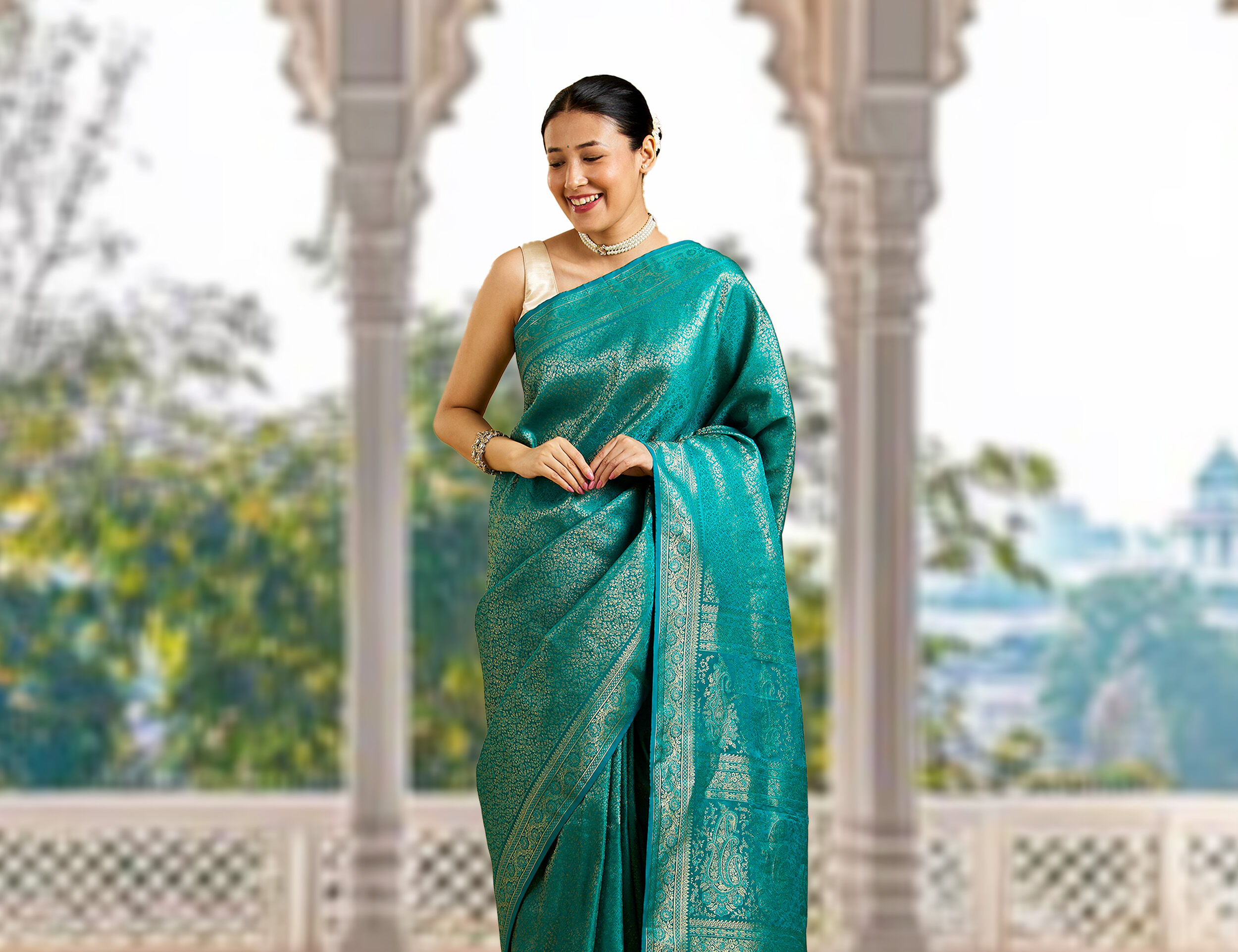 Woman draped in a stylish green silk saree, perfect for festive occasions.
